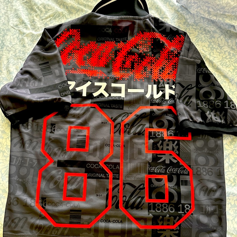 Coca Cola Men’s Black Graphic Jersey Shirt with Red Accents- soccer